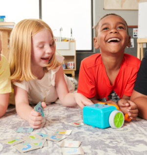 http://School-age%20children%20playing%20with%20a%20robot%20in%20New%20Horizon%20Academy's%20summer%20program